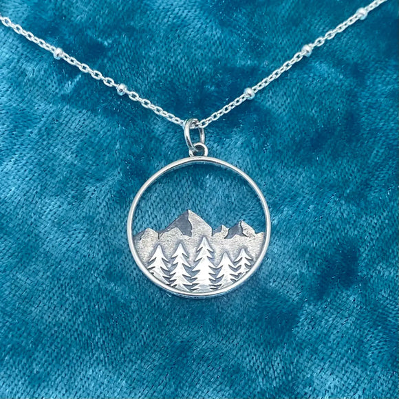Silver layered tree AND mountain pendant in circle necklace