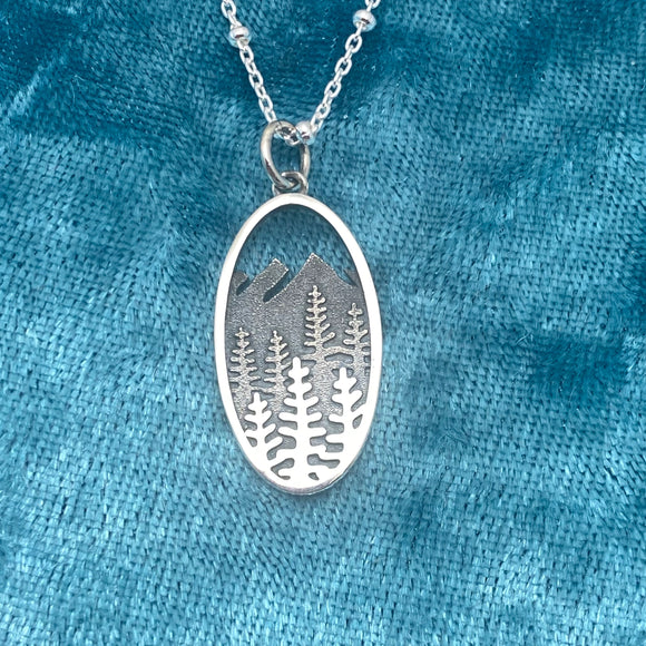 Silver oval trees and mountain necklace