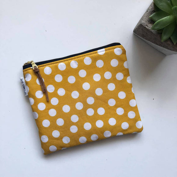 Simple zipped pouch in mustard polka dot